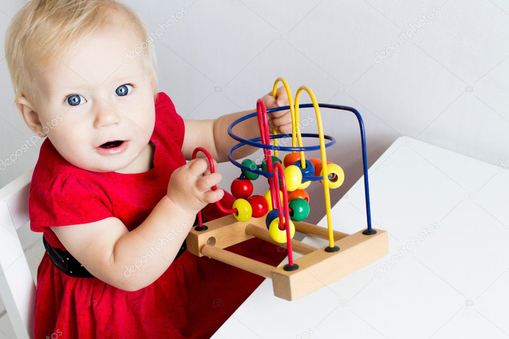 Baby Playing with a Developing Toy. Copy Space  