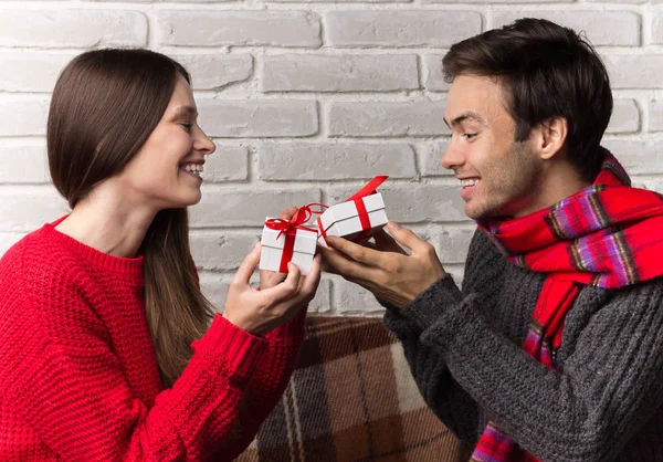 Man Gives a Gift to Woman. Christmas. New Year