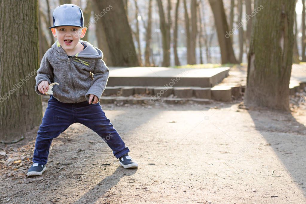 Little Boy Running around the Park