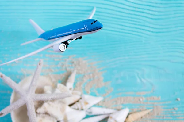 Holiday Still Life. Holidays. Airplane on Sea Background — Stock Photo, Image