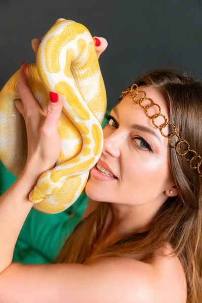 Beautiful Sensual Woman with a Yellow Snake.