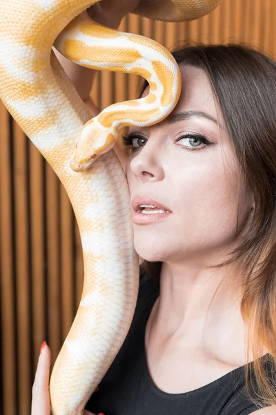 Beautiful Sensual Woman with a Yellow Snake.