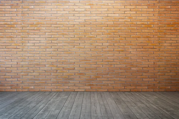 Chambre vide avec mur de briques et plancher de bois — Photo