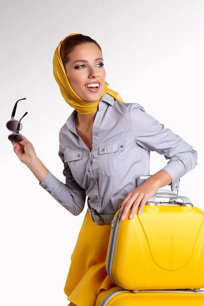 Woman with yellow suitcase — Stock Photo, Image