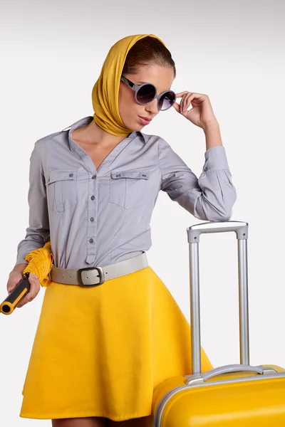 Woman with yellow suitcase — Stock Photo, Image