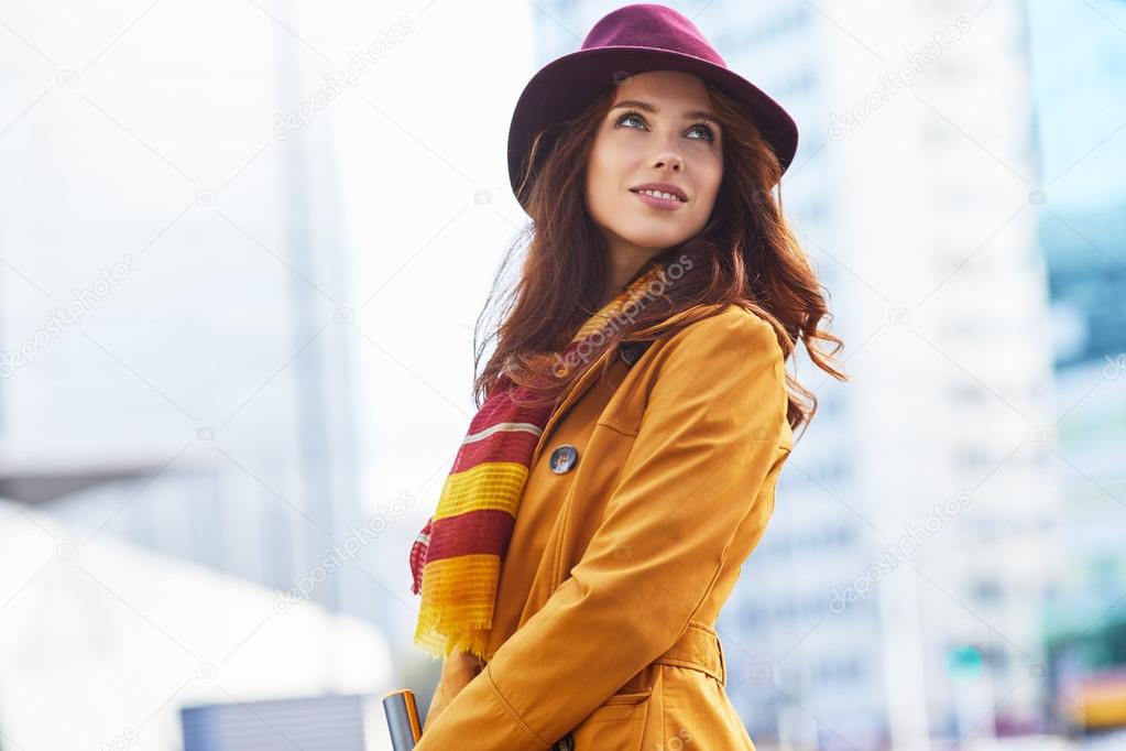 beautiful woman in autumn city