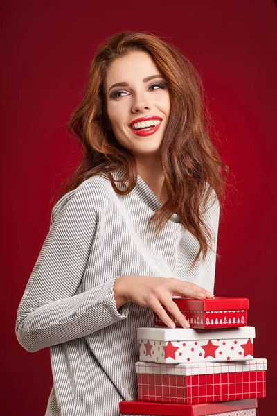Woman with christmas gifts — Stock Photo, Image