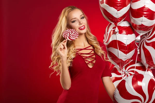 Beautiful girl in the studio with balloons — Stock Photo, Image
