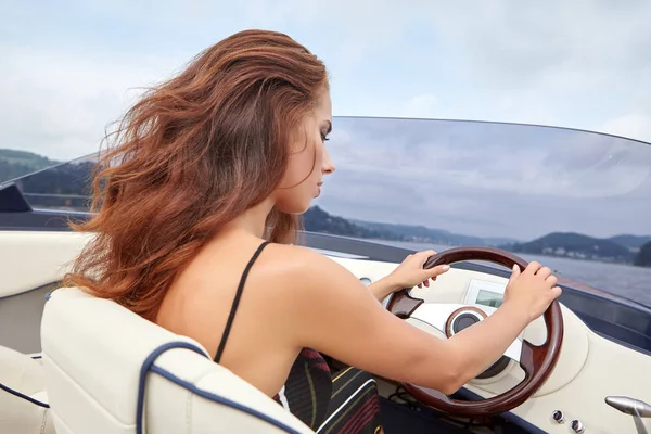 Young girl on a motor boat — Stock Photo, Image