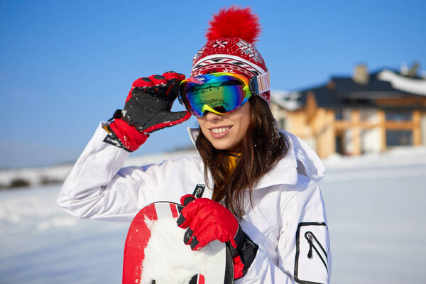 Sporty woman snowboarder