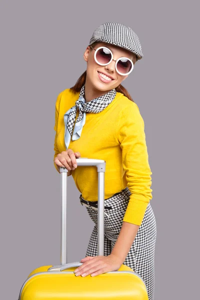 Glamour woman with yellow suitcase — Stock Photo, Image