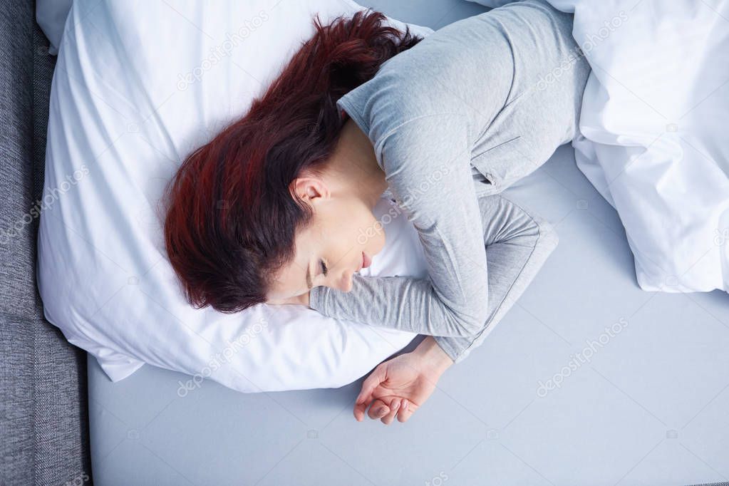 Portrait of cute young woman sleeping 