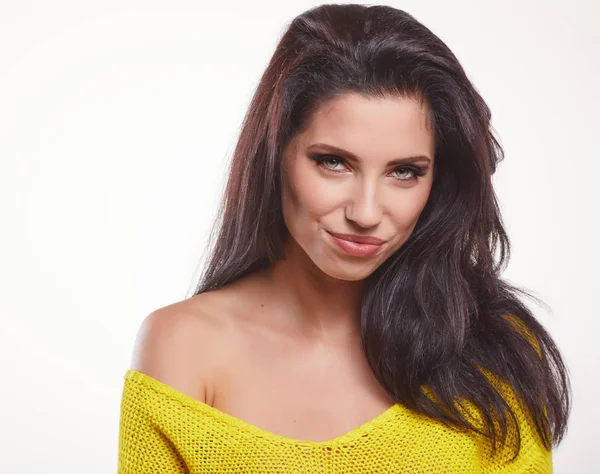 Pretty brunette woman in yellow pullover — Stock Photo, Image