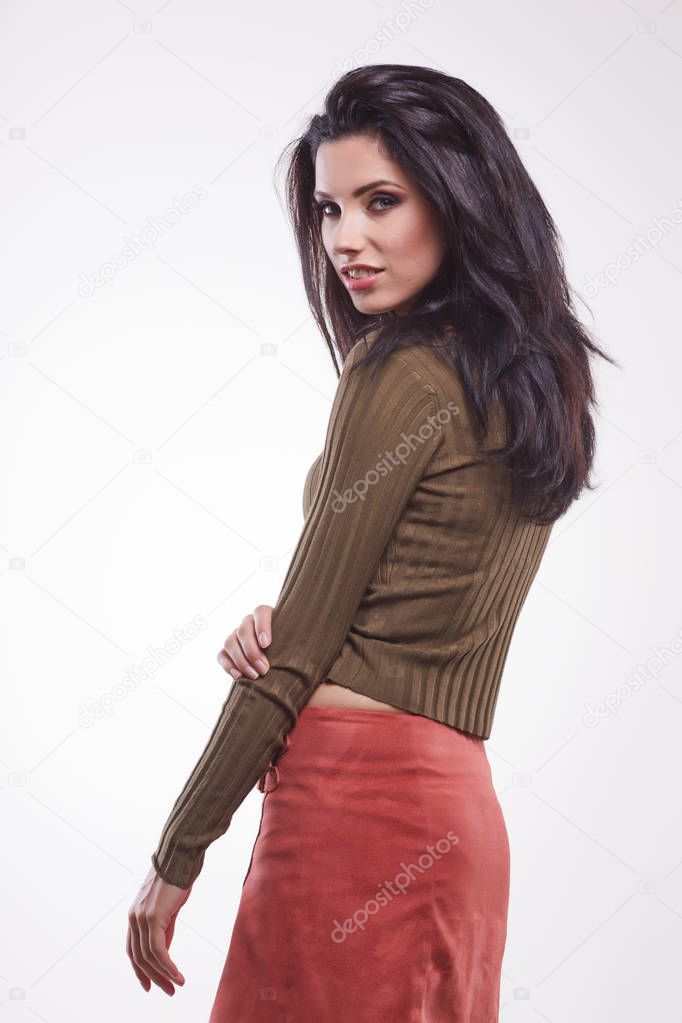 cute woman in green pullover and red skirt 