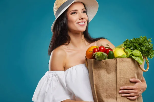 Happy Woman Holding Grocery Shopping Bag