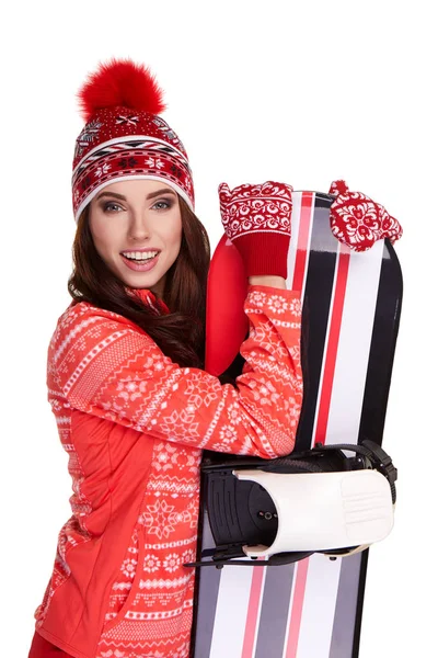 Mujer sosteniendo un snowboard en estudio — Foto de Stock