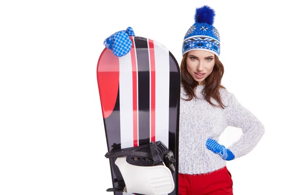 Mulher segurando um snowboard no estúdio — Fotografia de Stock