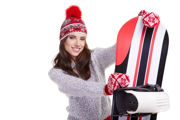 Mujer sosteniendo un snowboard en estudio —  Fotos de Stock