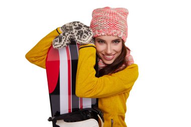 Bir snowboard studio tutan Kış elbise giyen kadın