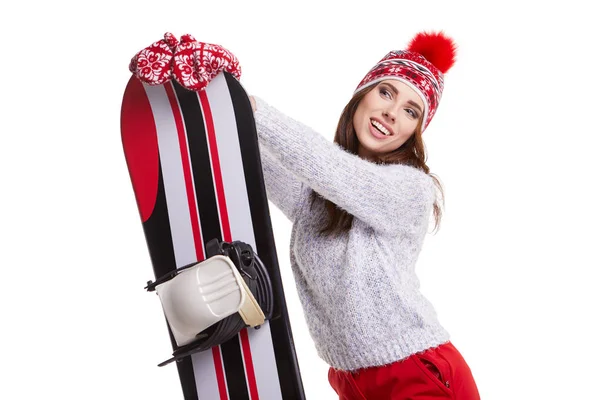 女人穿着冬衣在工作室举行滑雪 — 图库照片