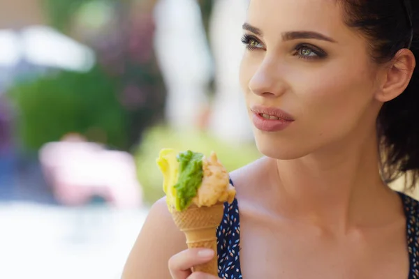 Woman eating a delicious pistachio ice cream
