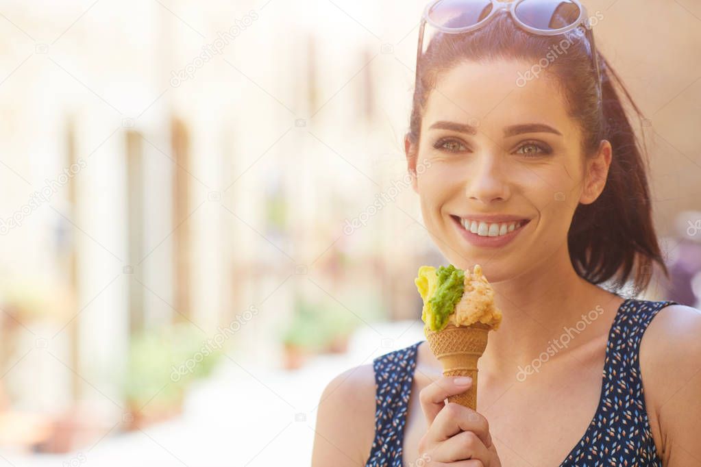 Woman eating a delicious pistachio ice cream