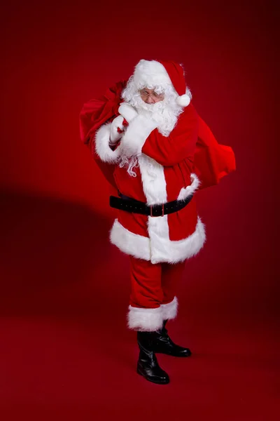 stock image Santa Claus with a bag of gifts