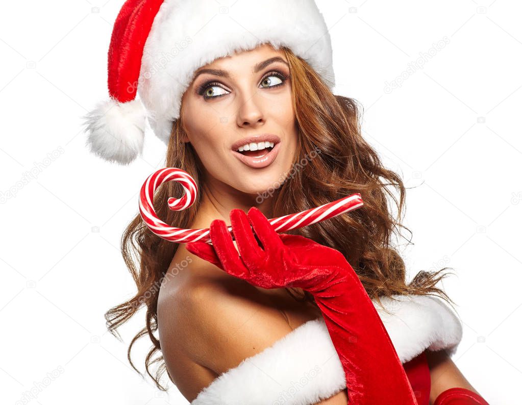 Beautiful woman with santa hat holding red -white Christmas Loll