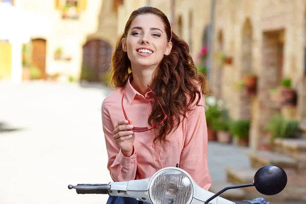 Woman on a scooter on the streets — Stock Photo, Image