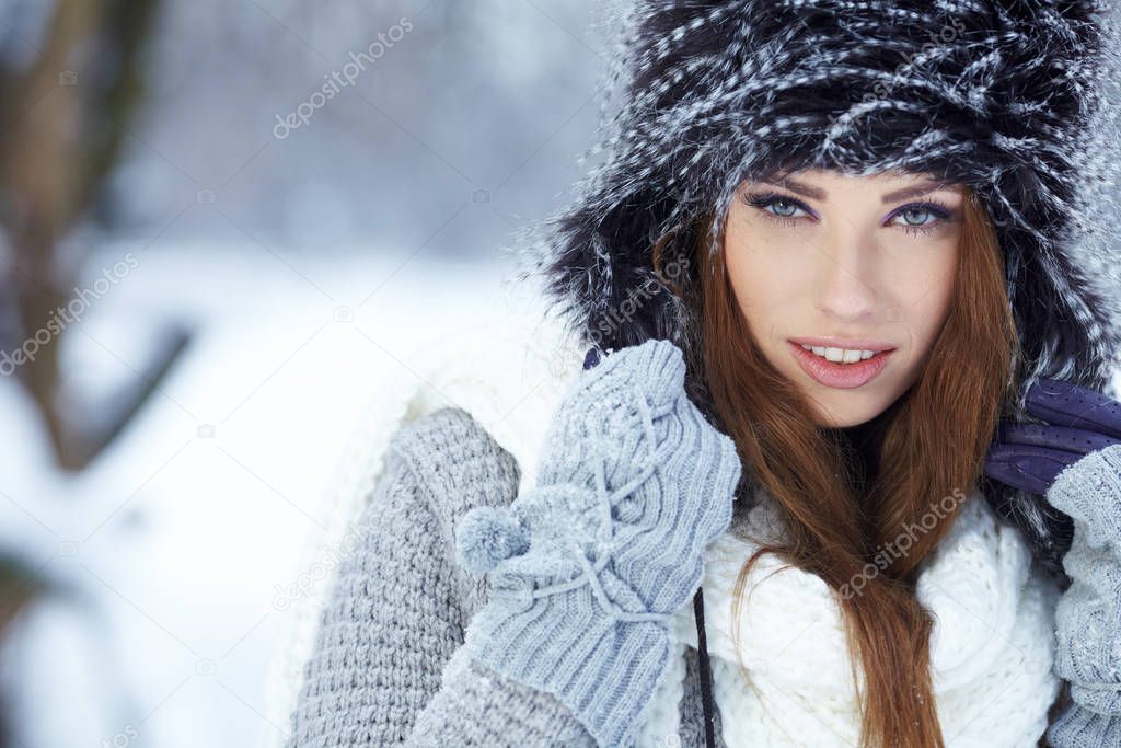 portrait of a young woman in winter park 