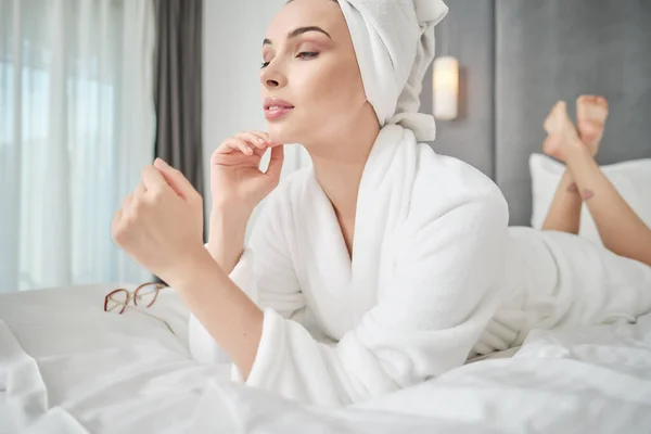 Woman Bathrobe Lies Bed Home — Stock Photo, Image