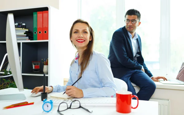 Beautiful young woman and man working from home — Stock Photo, Image
