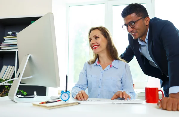 Beautiful young woman and man working from home — Stock Photo, Image