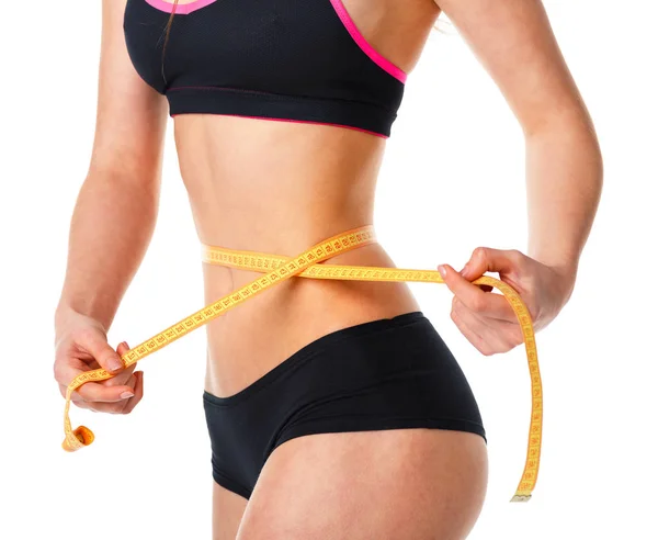 Woman measuring perfect shape of beautiful waist Stock Picture