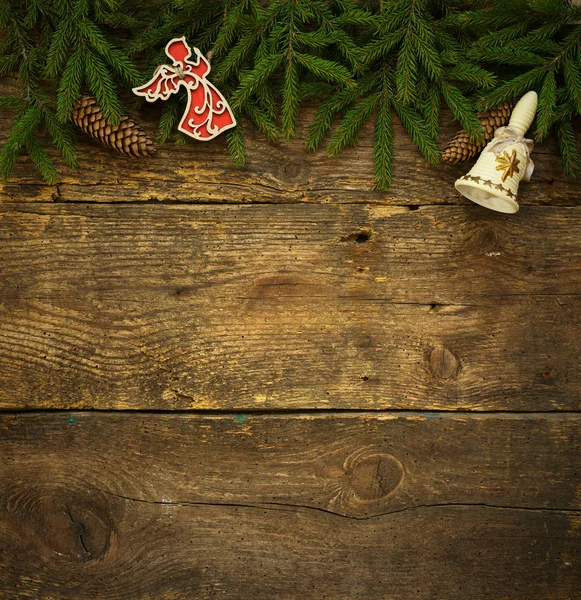 Christmas tree branches with cones and christmas decorations on