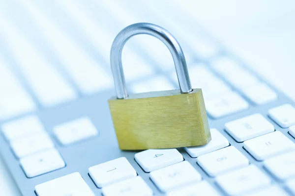 Security lock on white computer keyboard — Stock Photo, Image