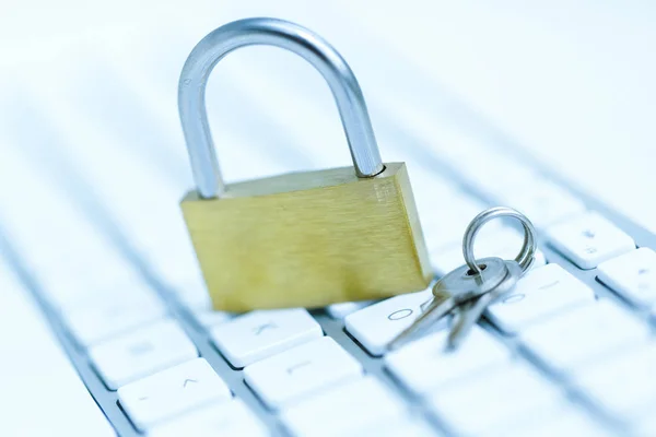 Security lock on white computer keyboard — Stock Photo, Image