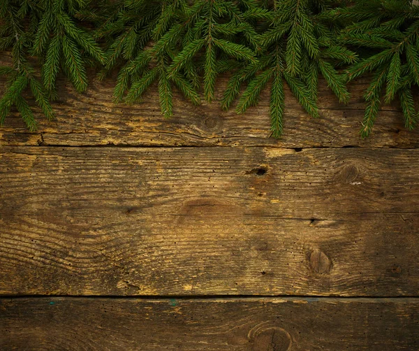 Χριστουγεννιάτικο δέντρο κλαδιά στην ξύλινη υφή έτοιμο για το σχεδιασμό σας — Φωτογραφία Αρχείου
