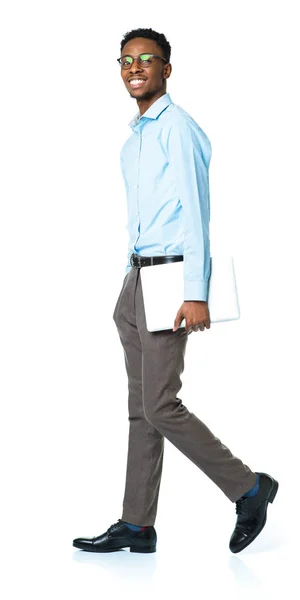 Happy african american college student standing with laptop on w — Stock Photo, Image