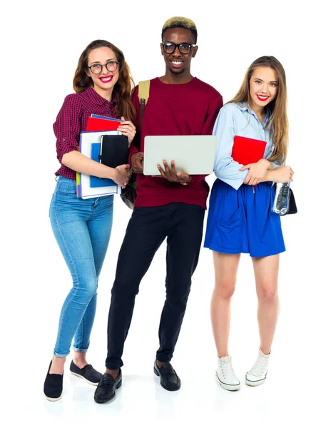 Tre studenti felici in piedi e sorridenti con i libri — Foto Stock