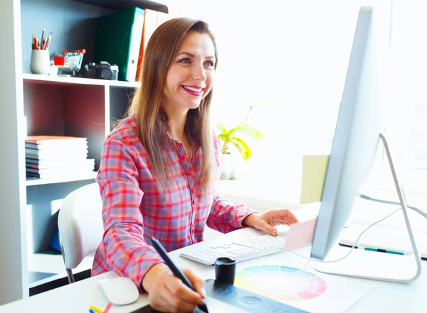 Graphic designer drawing something on graphic tablet at the work — Stock Photo, Image