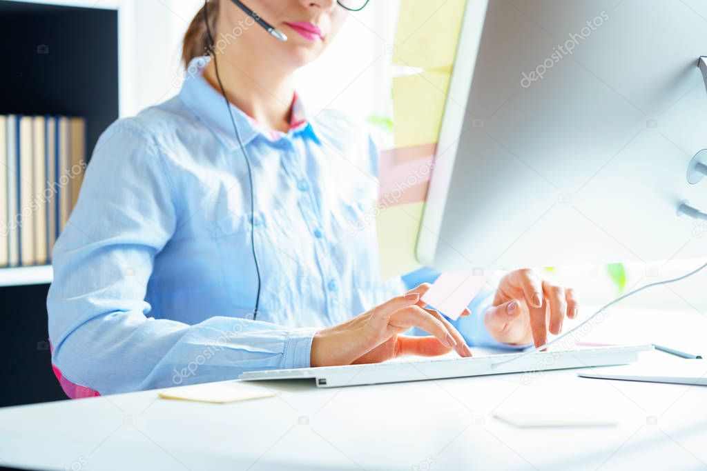 Close-up of woman working in a call center