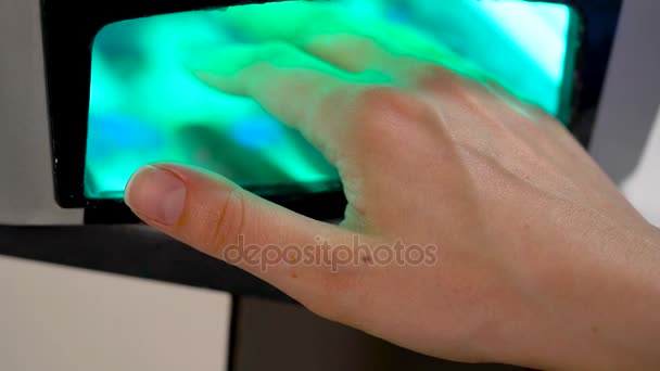 Beautiful woman hands and lamp for nails on table close up — Stock Video