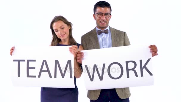 Two business partners posing in the studio with placards in hands. The concept of teamwork — Stock Video