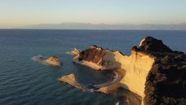 Aerial video of Cape Drastis at Corfu island in Greece. Picturesque coast of Corfu island. Beautiful sea landscape. — Stock Video