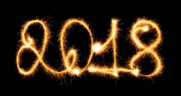 2018 with sparklers on black background — Stock Photo, Image