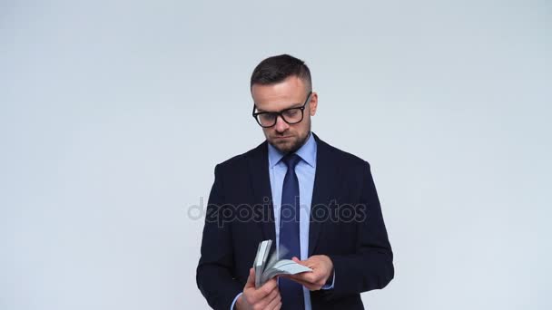 Man is satisfied with American dollars and gives them to another person — Stock Video