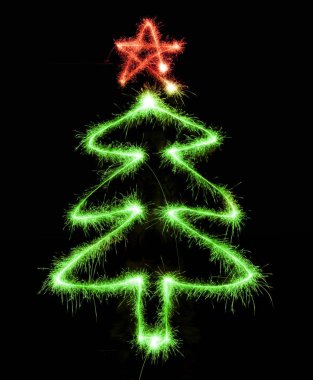 Noel ağacı üzerinde siyah bir maytap tarafından yapılan