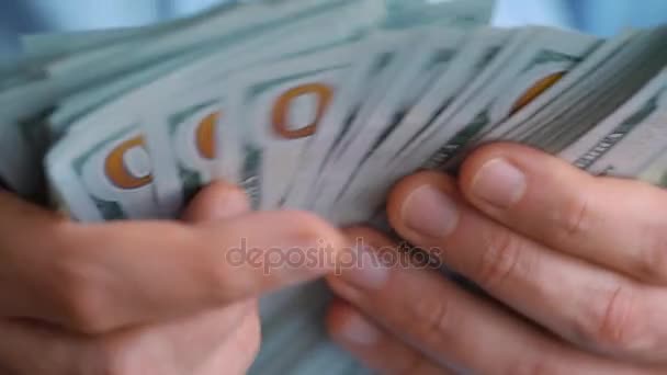 Close-up of mans hands counting hundred dollar bills. Slow motion — Stock Video