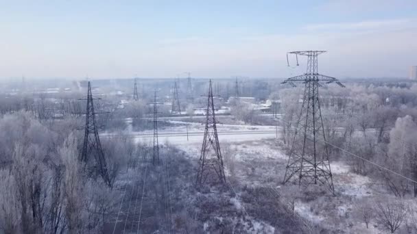 Aerial view of the power line near the railway in winter — Stock Video